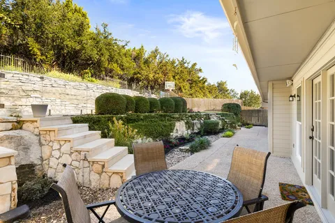 a view of balcony with furniture