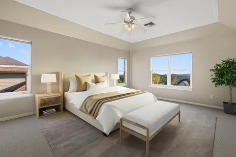 a large bathroom with a granite countertop tub sink shower and mirror
