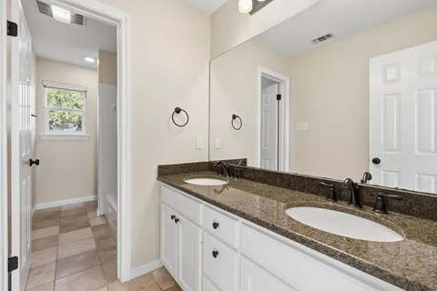 a bathroom with a bathtub and shower