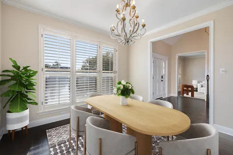 a view of a dining room with furniture and window