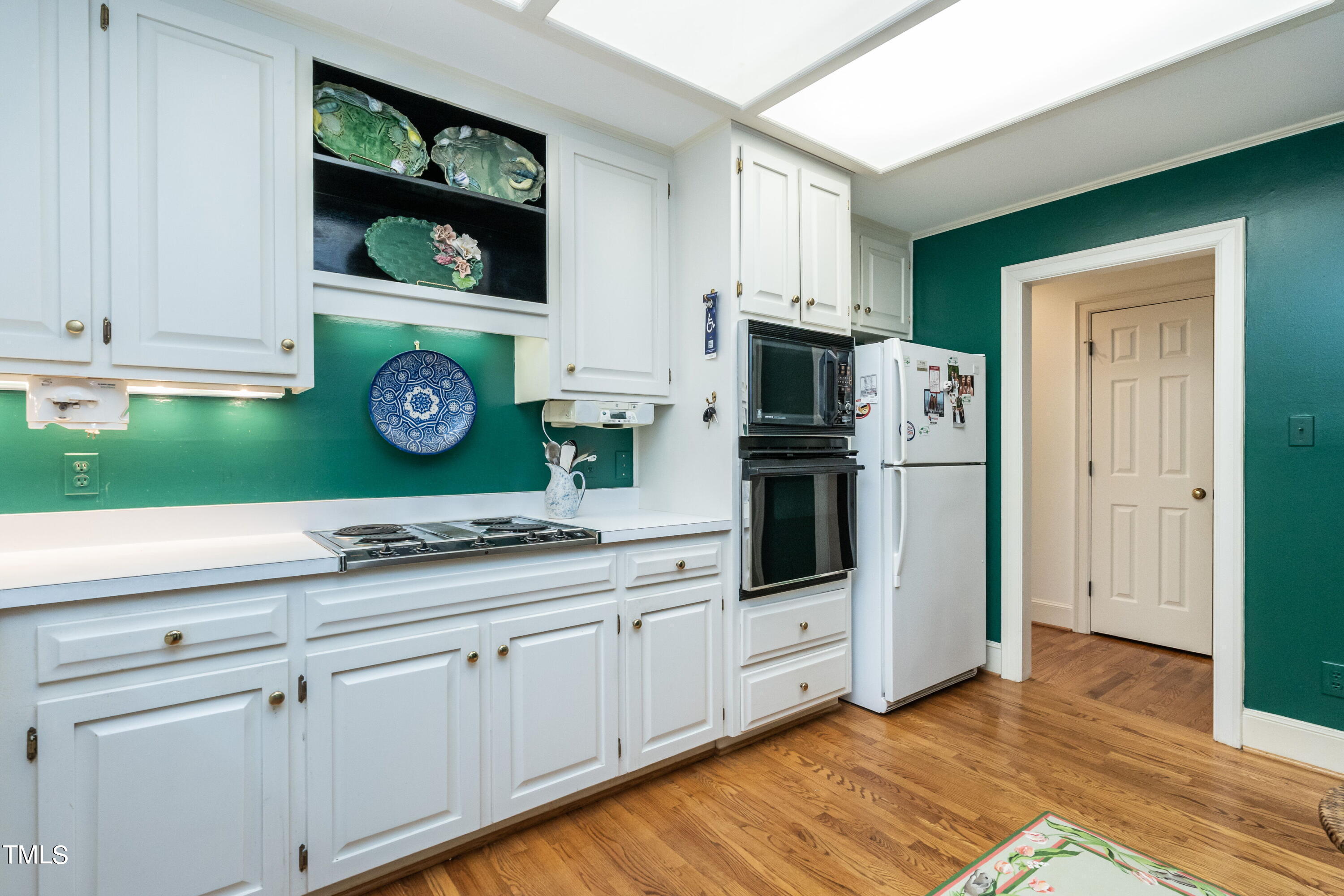 3341 Ridgecrest Court Raleigh, NC 27607 - Photo 11 of 26 a kitchen with stainless steel appliances granite countertop a refrigerator and a stove