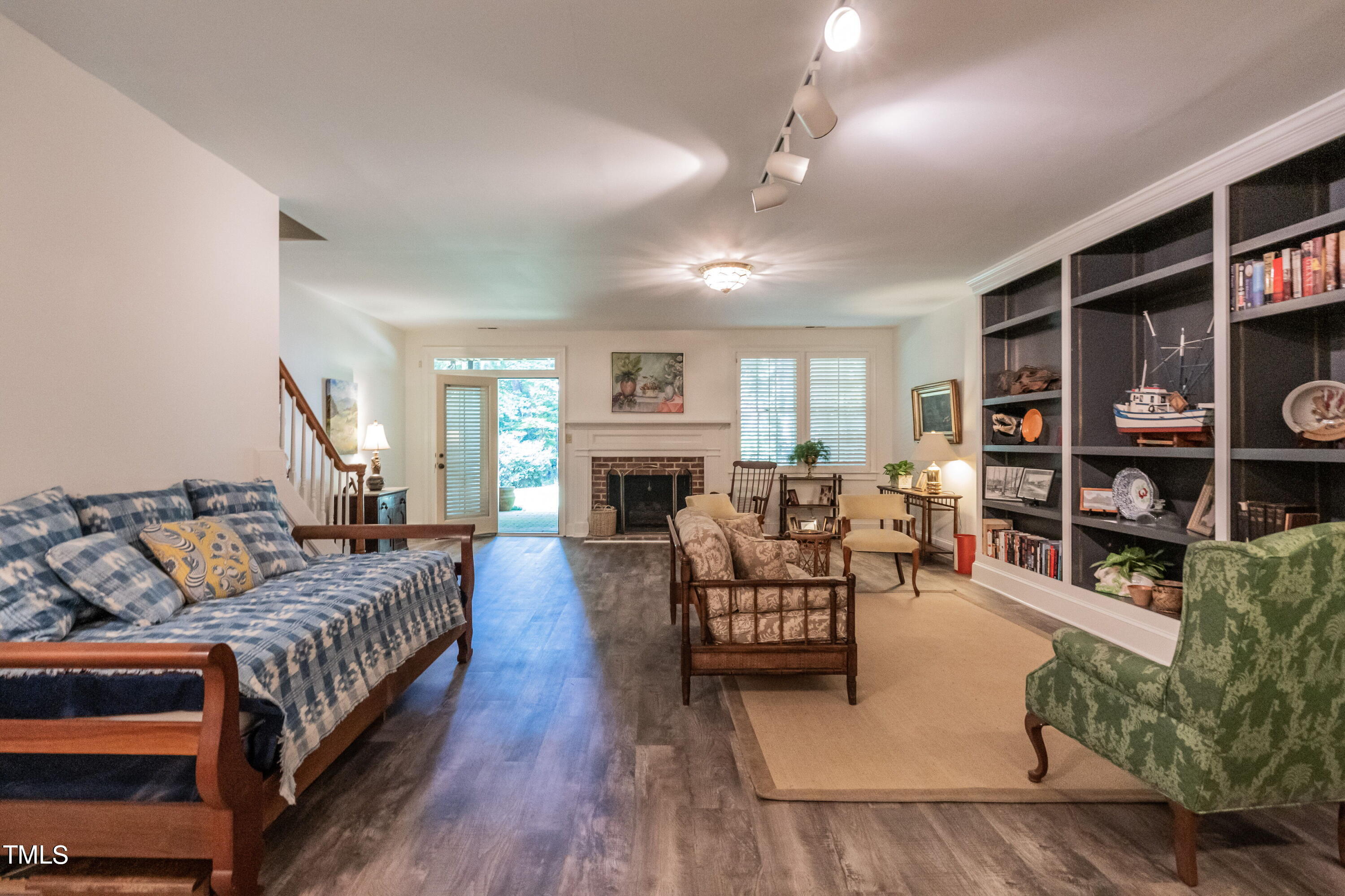 3341 Ridgecrest Court Raleigh, NC 27607 - Photo 20 of 26 a living room with furniture and a fireplace