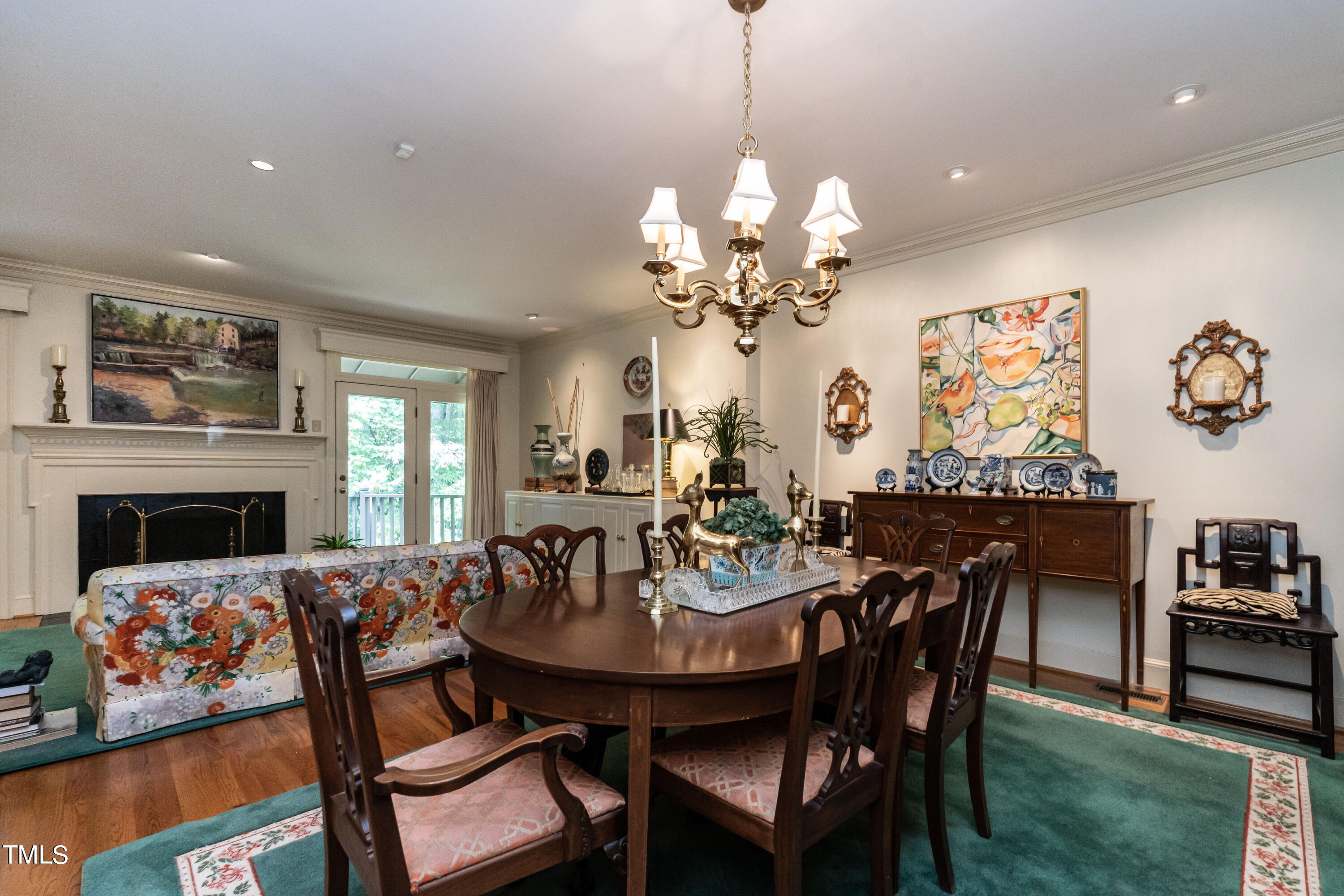 3341 Ridgecrest Court Raleigh, NC 27607 - Photo 4 of 26 a view of a dining room with furniture and chandelier