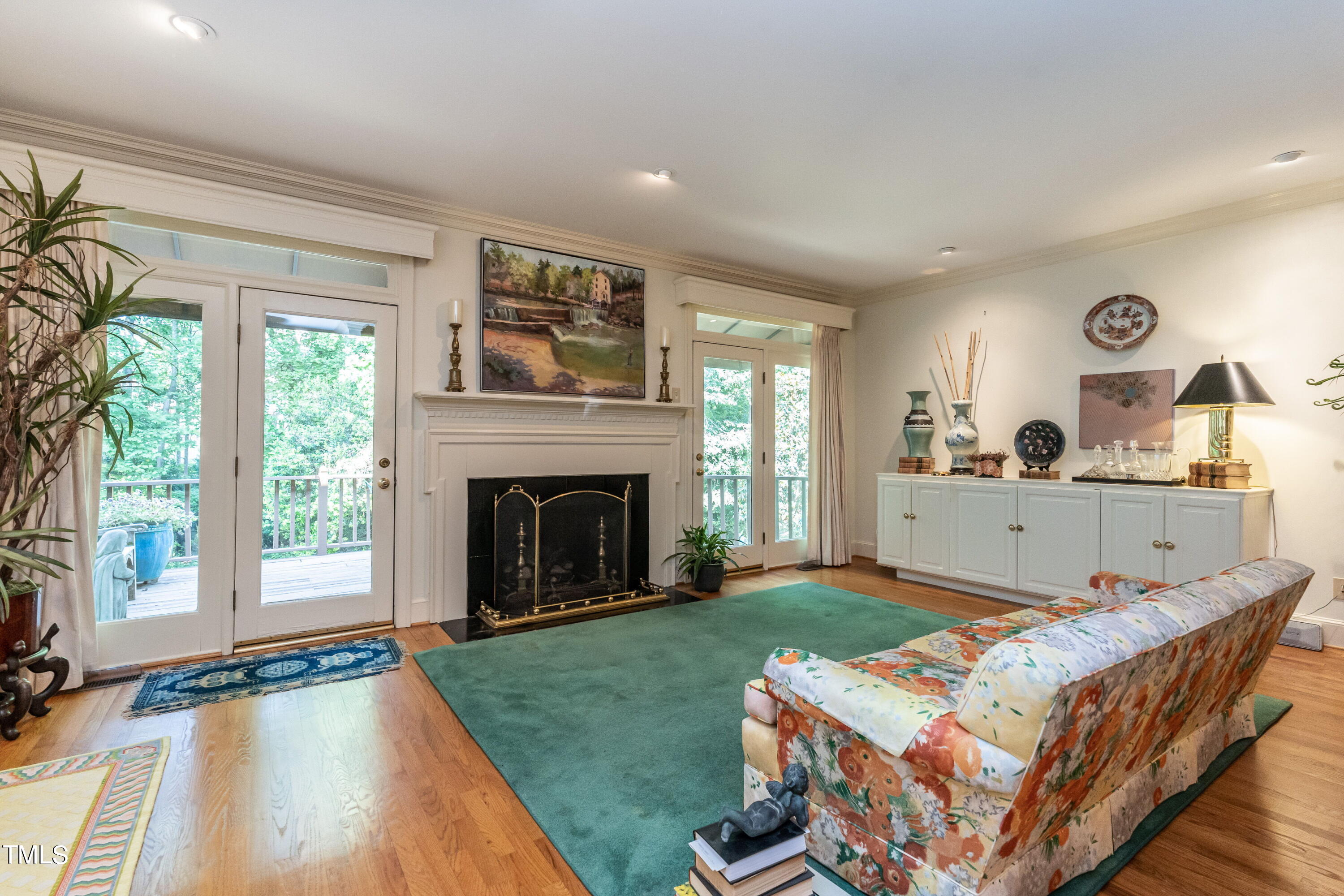 3341 Ridgecrest Court Raleigh, NC 27607 - Photo 6 of 26 a living room with furniture and a fireplace