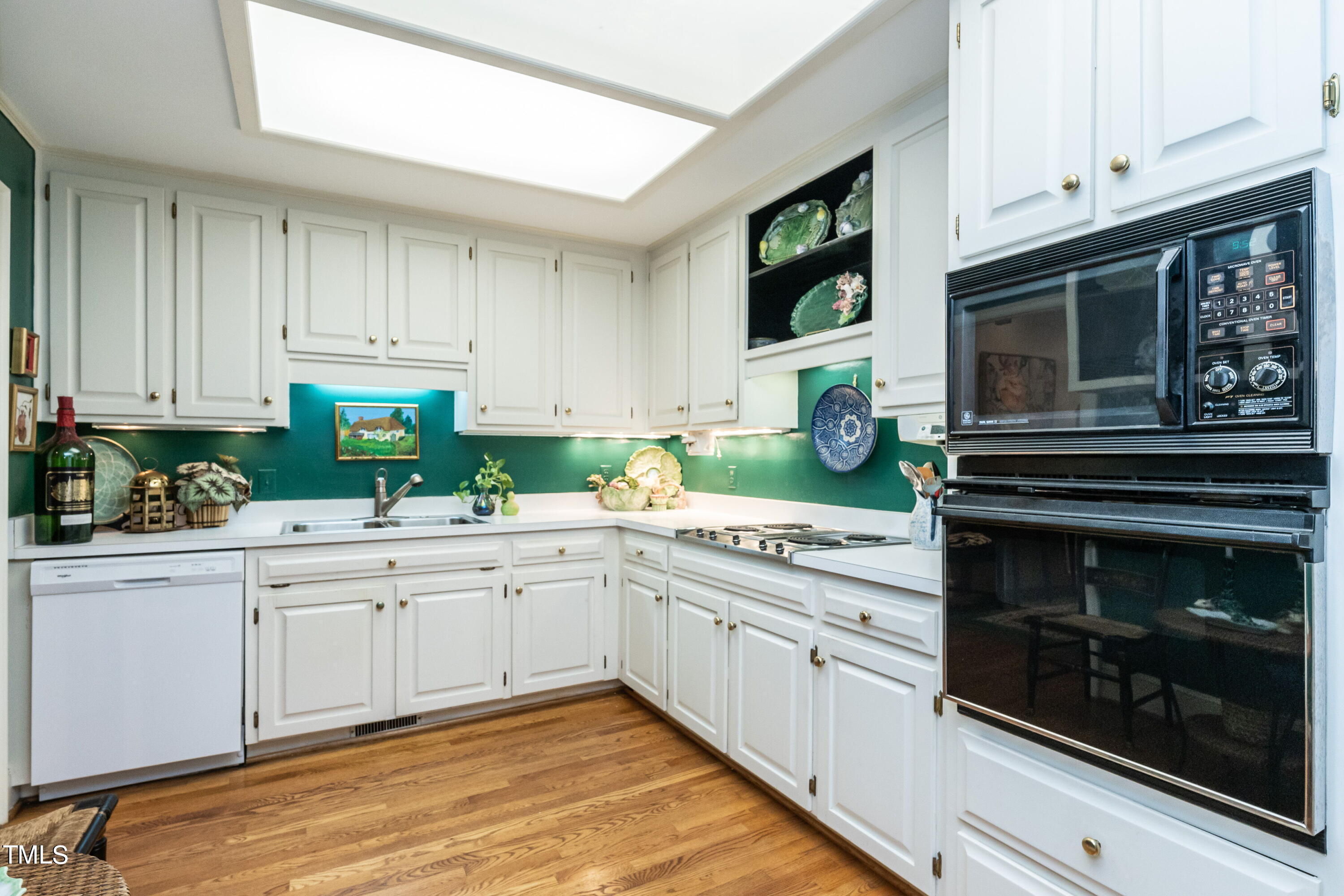3341 Ridgecrest Court Raleigh, NC 27607 - Photo 10 of 26 a kitchen with stainless steel appliances granite countertop a stove microwave and cabinets
