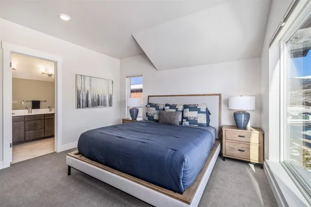 a bedroom with a bed and a view of bedroom