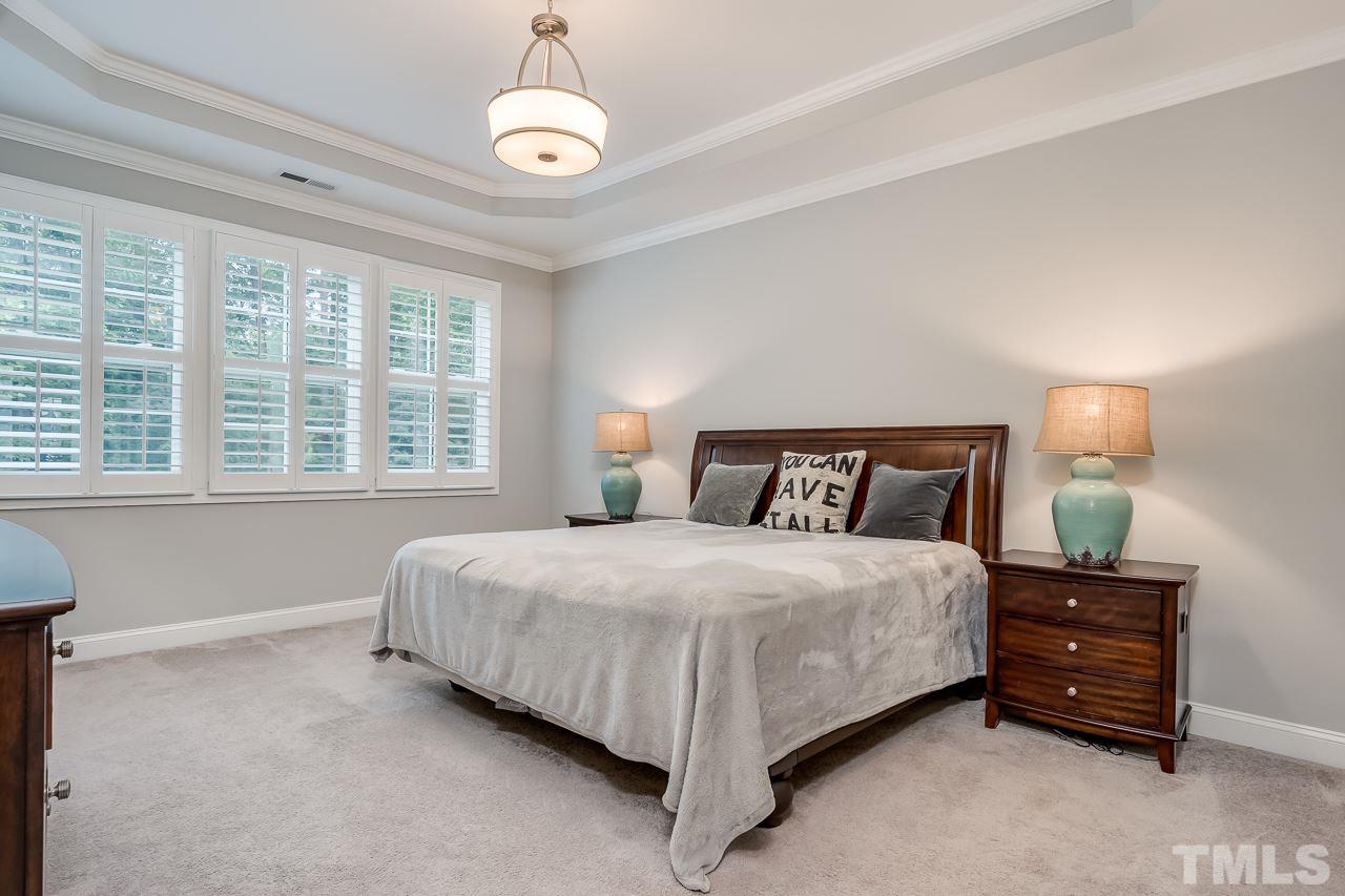3608 Julia Lane Raleigh, NC 27609 - Photo 11 of 30 a bedroom with bed and a large window