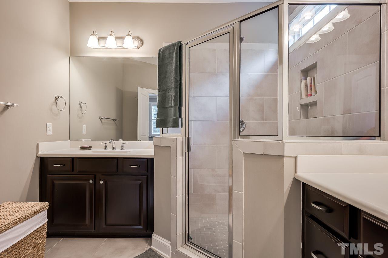 3608 Julia Lane Raleigh, NC 27609 - Photo 12 of 30 a bathroom with a sink and a mirror
