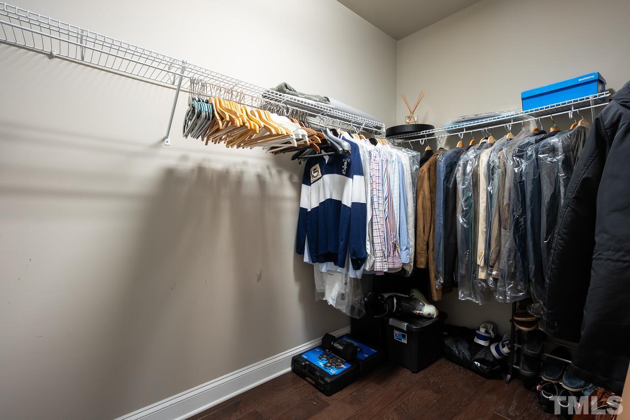 3608 Julia Lane Raleigh, NC 27609 - Photo 14 of 30 a view of walk in closet with clothes and shoes