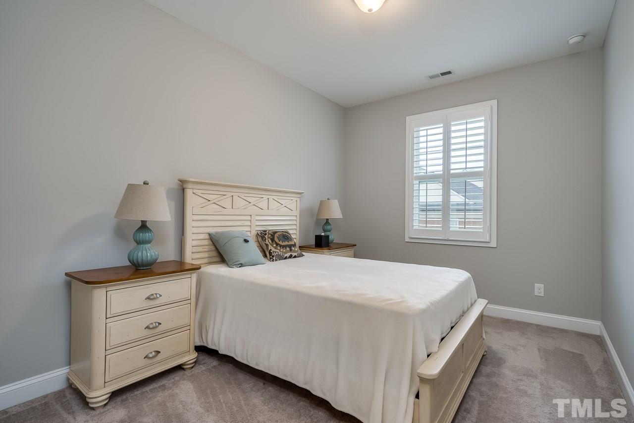 3608 Julia Lane Raleigh, NC 27609 - Photo 15 of 30 a bedroom with a bed and a window