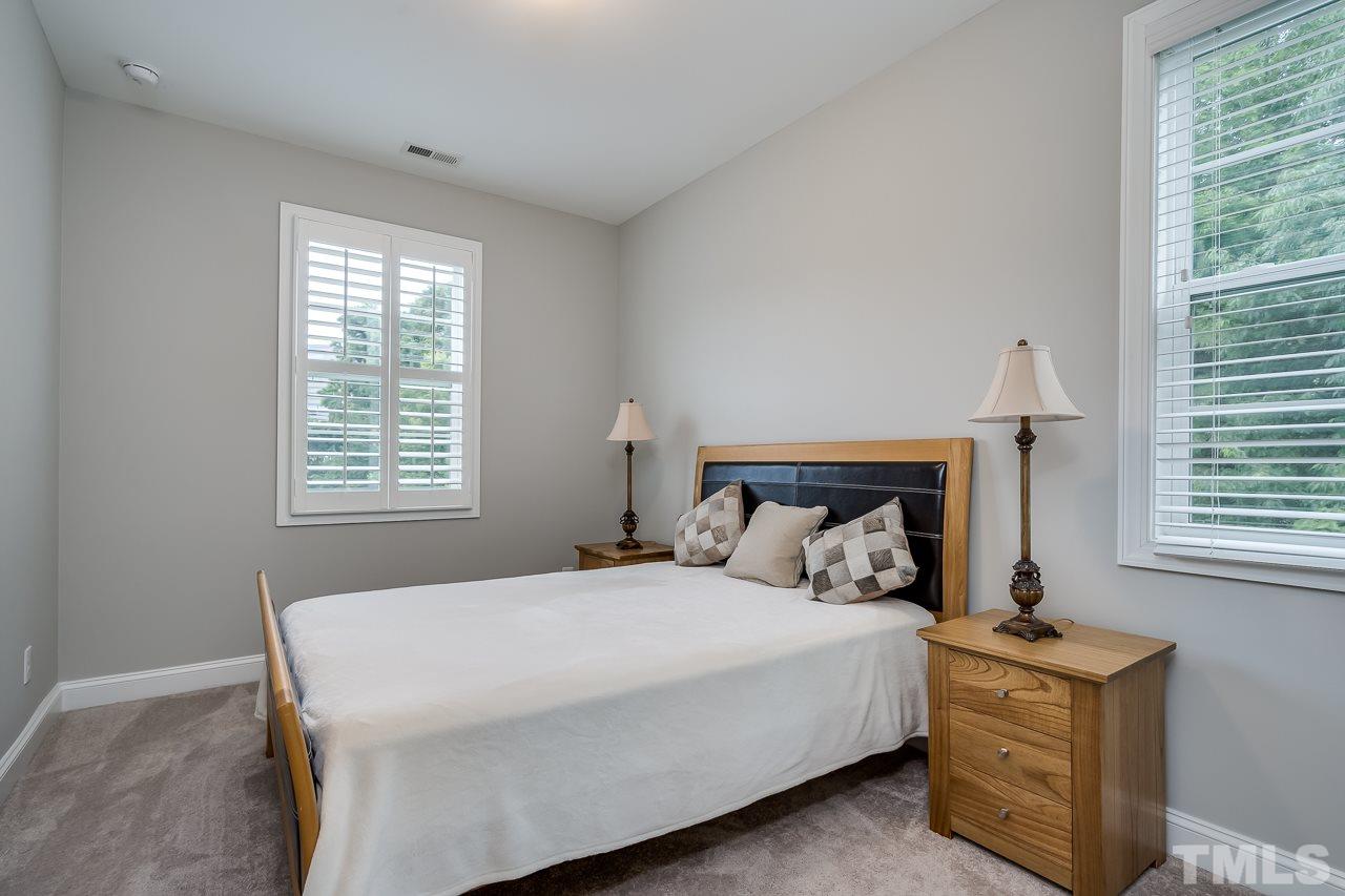 3608 Julia Lane Raleigh, NC 27609 - Photo 17 of 30 a bedroom with a bed and a window