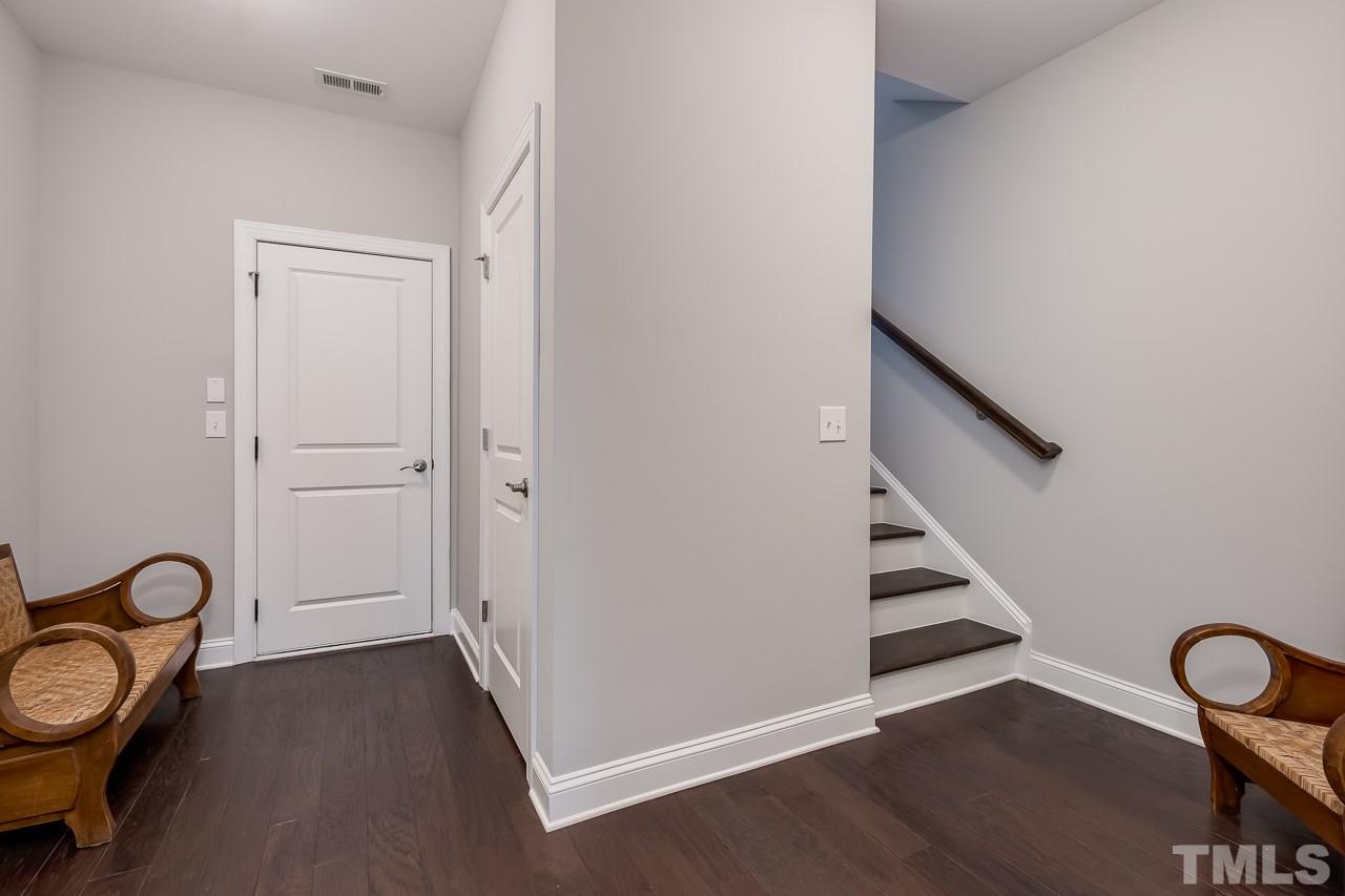 3608 Julia Lane Raleigh, NC 27609 - Photo 18 of 30 a view of a room with wooden floor and white walls