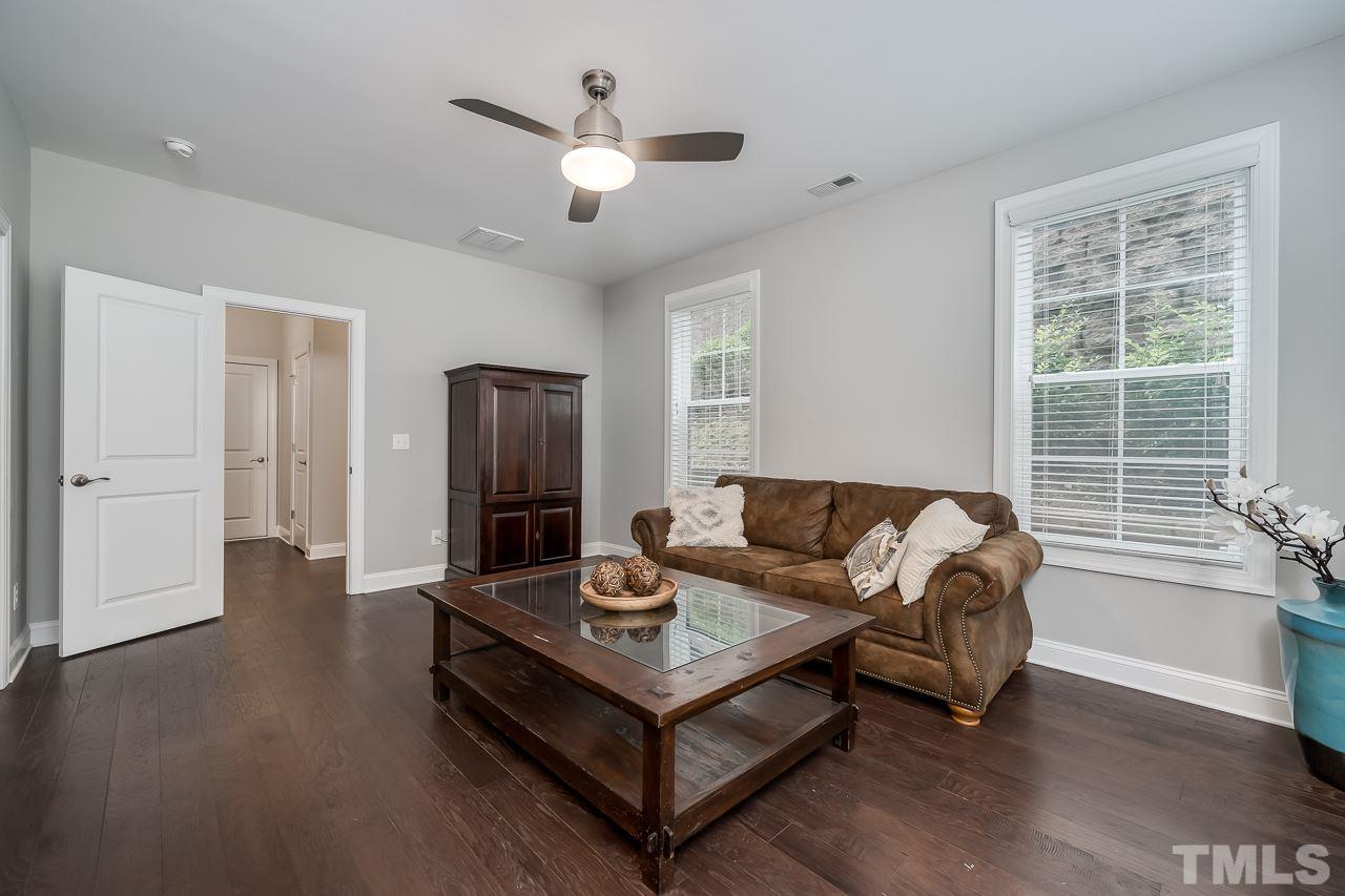 3608 Julia Lane Raleigh, NC 27609 - Photo 21 of 30 a living room with furniture and a chandelier