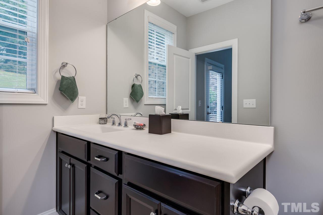 3608 Julia Lane Raleigh, NC 27609 - Photo 22 of 30 a bathroom with a sink and a mirror