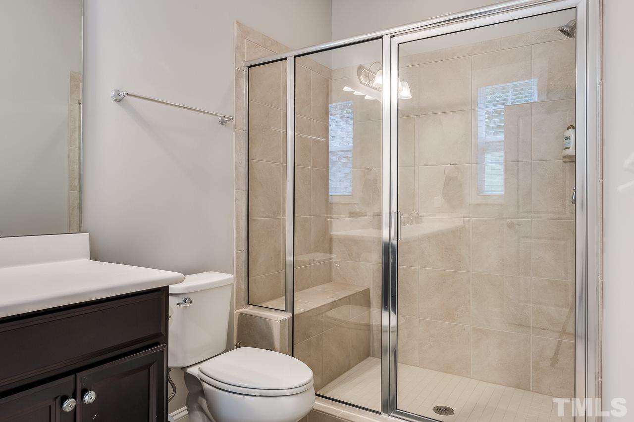 3608 Julia Lane Raleigh, NC 27609 - Photo 23 of 30 a bathroom with a shower a toilet and a sink