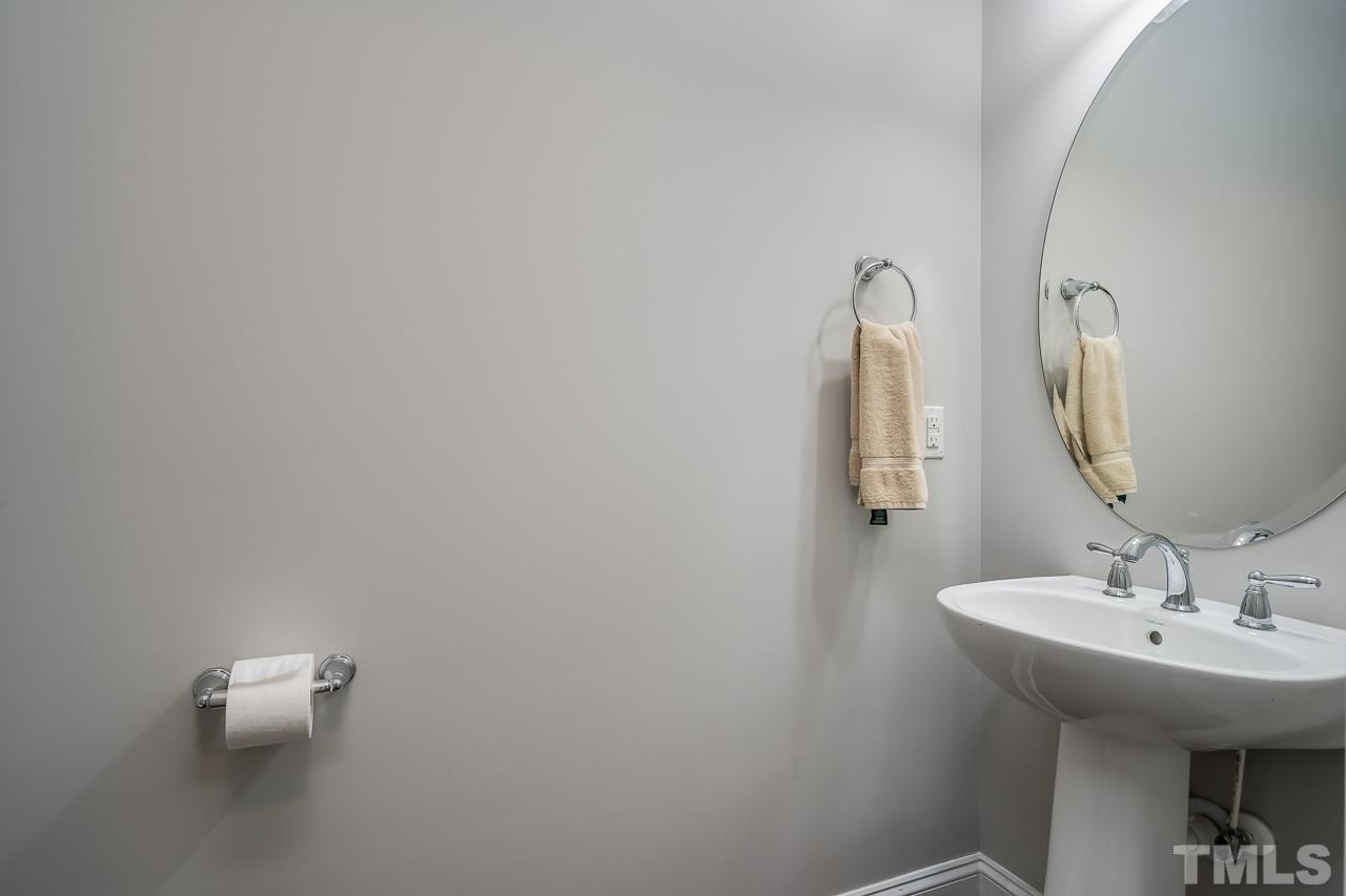 3608 Julia Lane Raleigh, NC 27609 - Photo 25 of 30 a bathroom with a sink and mirror