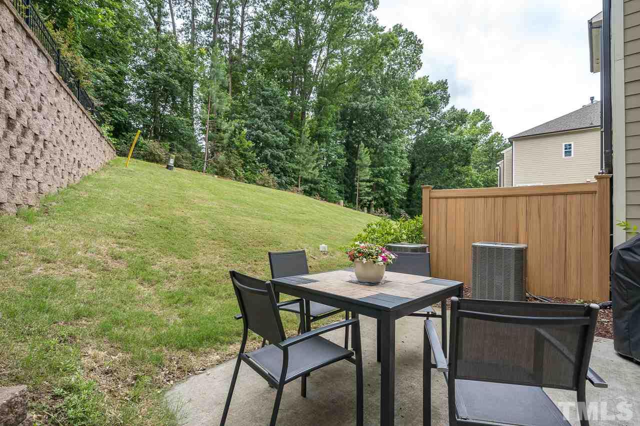 3608 Julia Lane Raleigh, NC 27609 - Photo 26 of 30 a backyard of a house with table and chairs