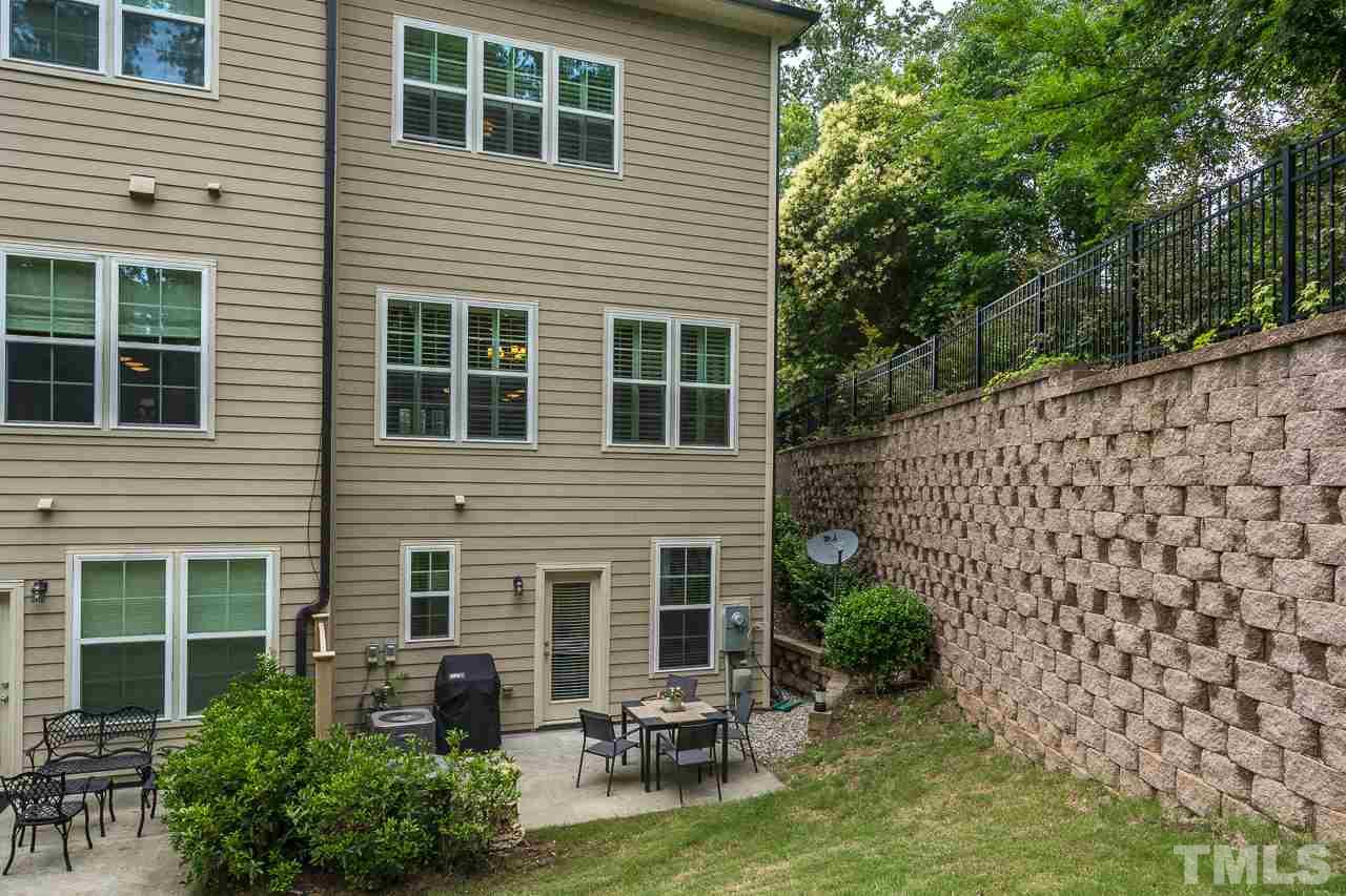 3608 Julia Lane Raleigh, NC 27609 - Photo 29 of 30 a view of a house with a chairs in patio