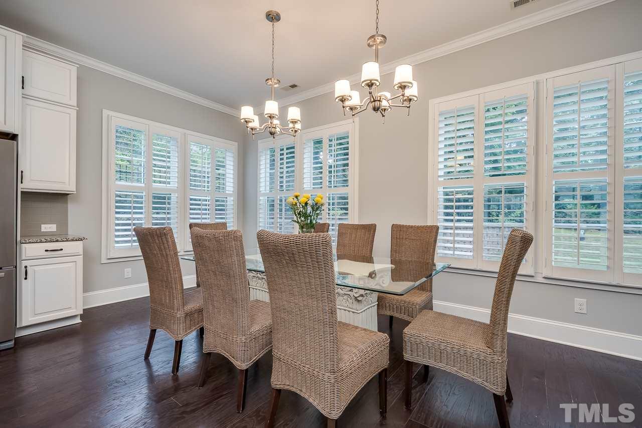 3608 Julia Lane Raleigh, NC 27609 - Photo 4 of 30 a view of a dining room with furniture window and wooden floor
