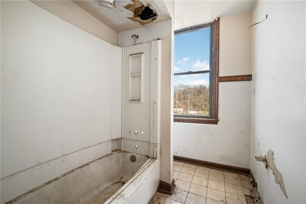 1339 Romanhoff Street Pittsburgh, PA 15212 - Photo 18 of 30 a bathroom with a bathtub and a window