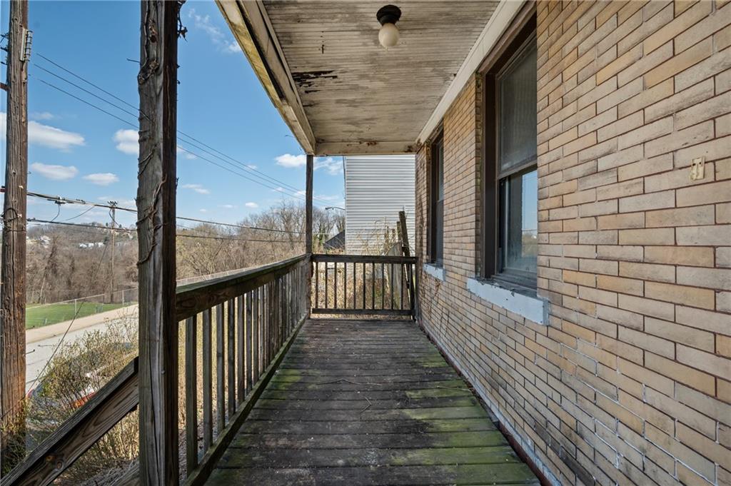 1339 Romanhoff Street Pittsburgh, PA 15212 - Photo 3 of 30 a view of a balcony with wooden floor