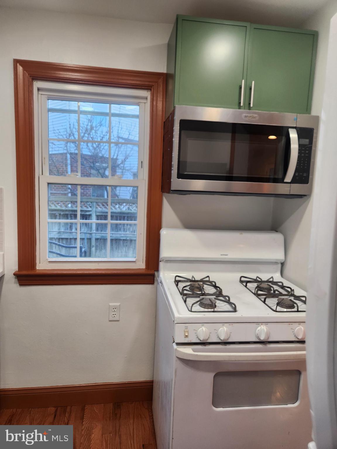 502 East Schuyler Road Silver Spring, MD 20901 - Photo 13 of 38 a kitchen with a stove and a microwave