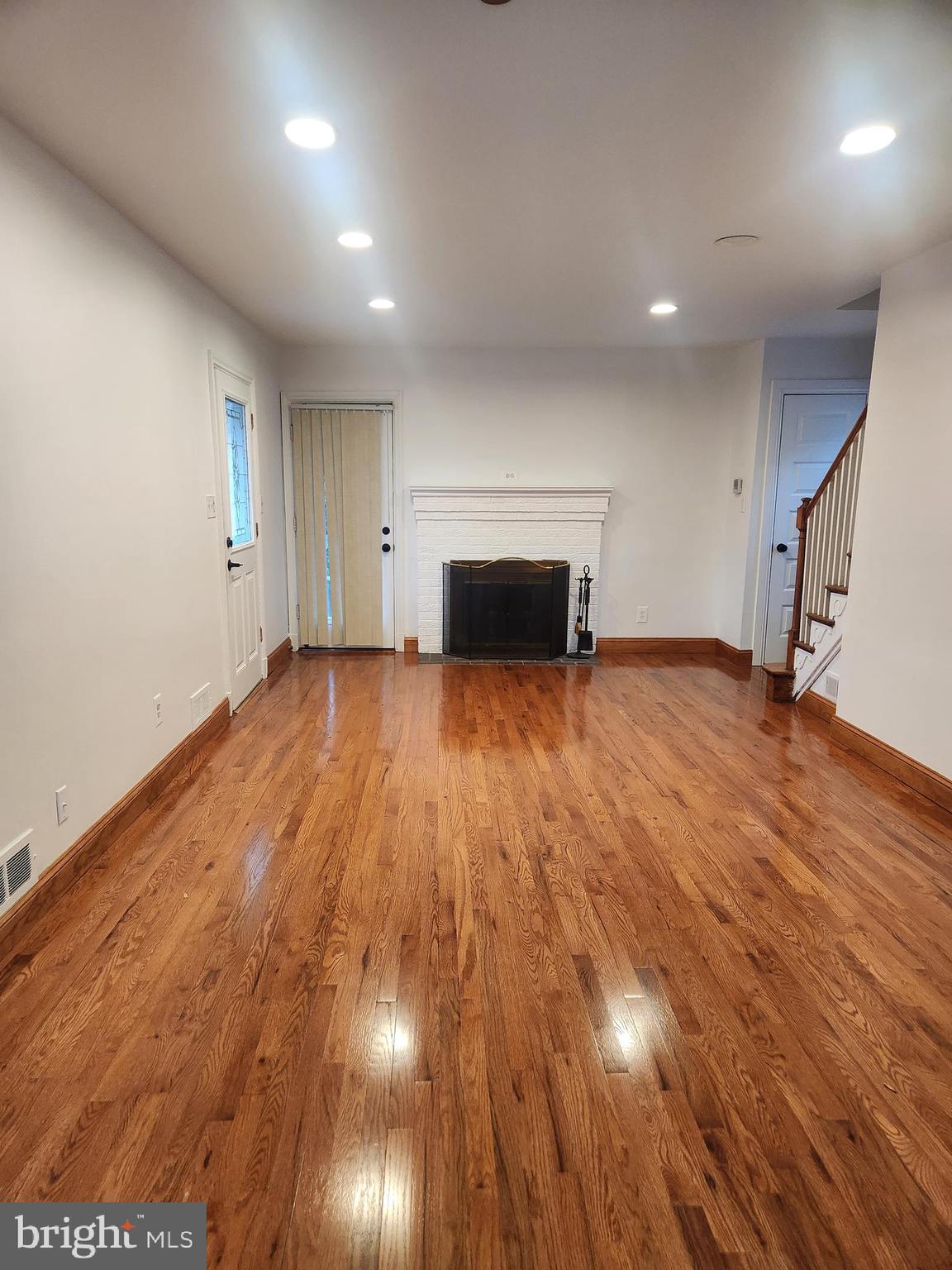 502 East Schuyler Road Silver Spring, MD 20901 - Photo 3 of 38 an empty room with wooden floor and windows