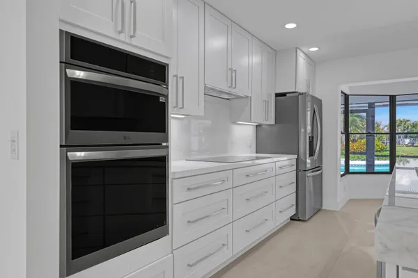 a kitchen with stainless steel appliances a stove and a refrigerator
