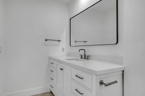 a bathroom with a toilet sink and window