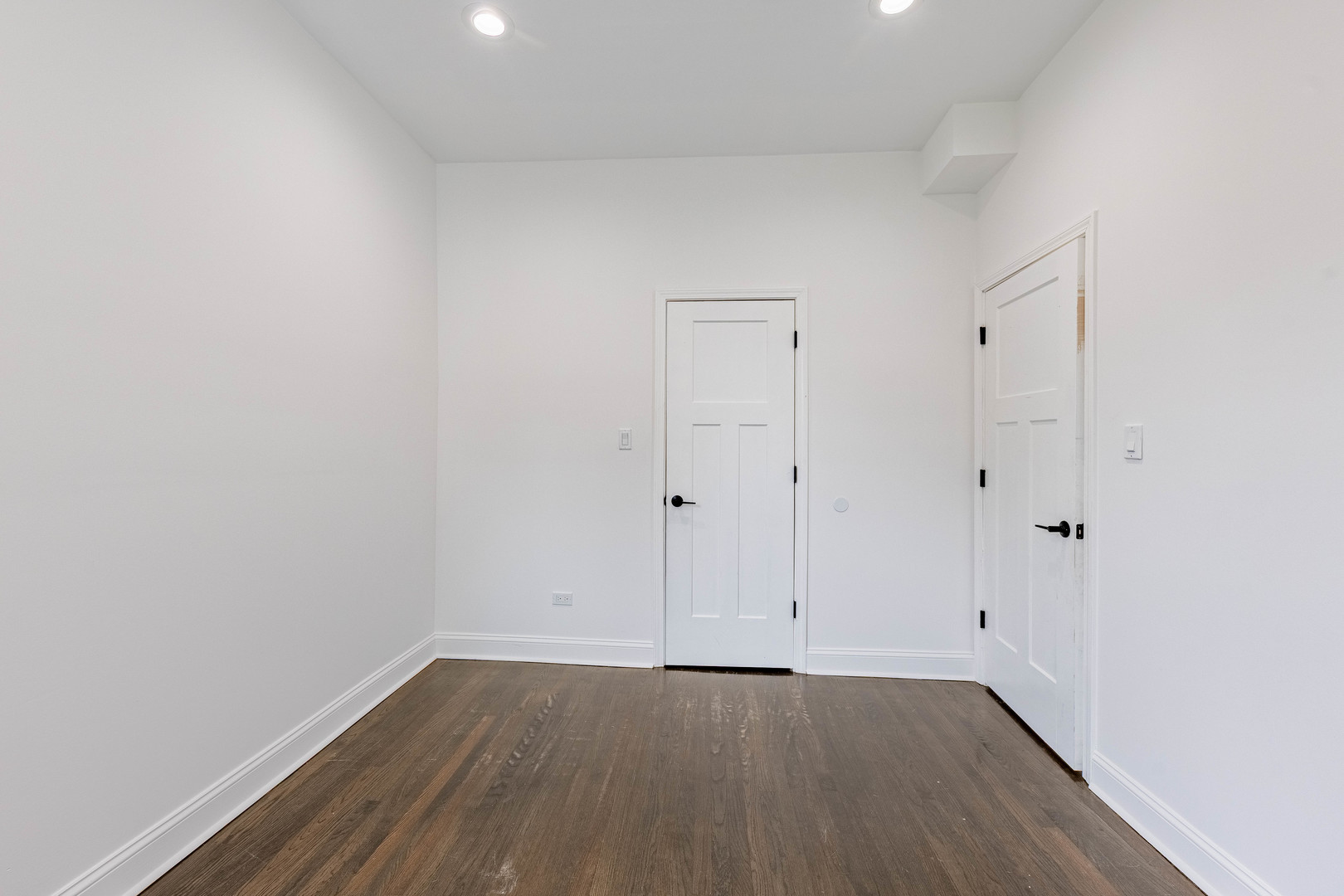 4453 West Adams Street Chicago, IL 60624 - Photo 12 of 32 a view of an empty room with wooden floor