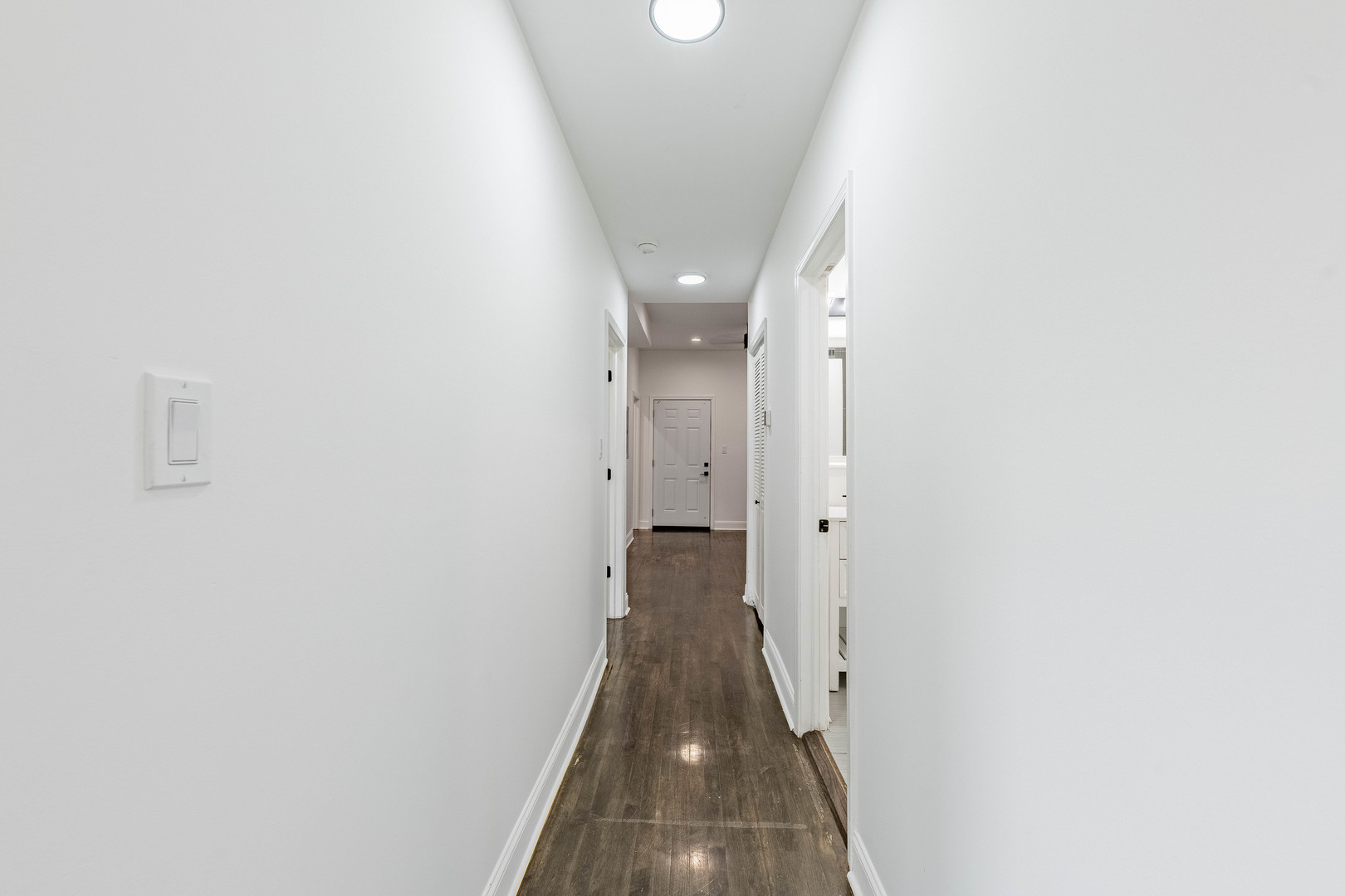 4453 West Adams Street Chicago, IL 60624 - Photo 16 of 32 a view of a hallway with wooden floor