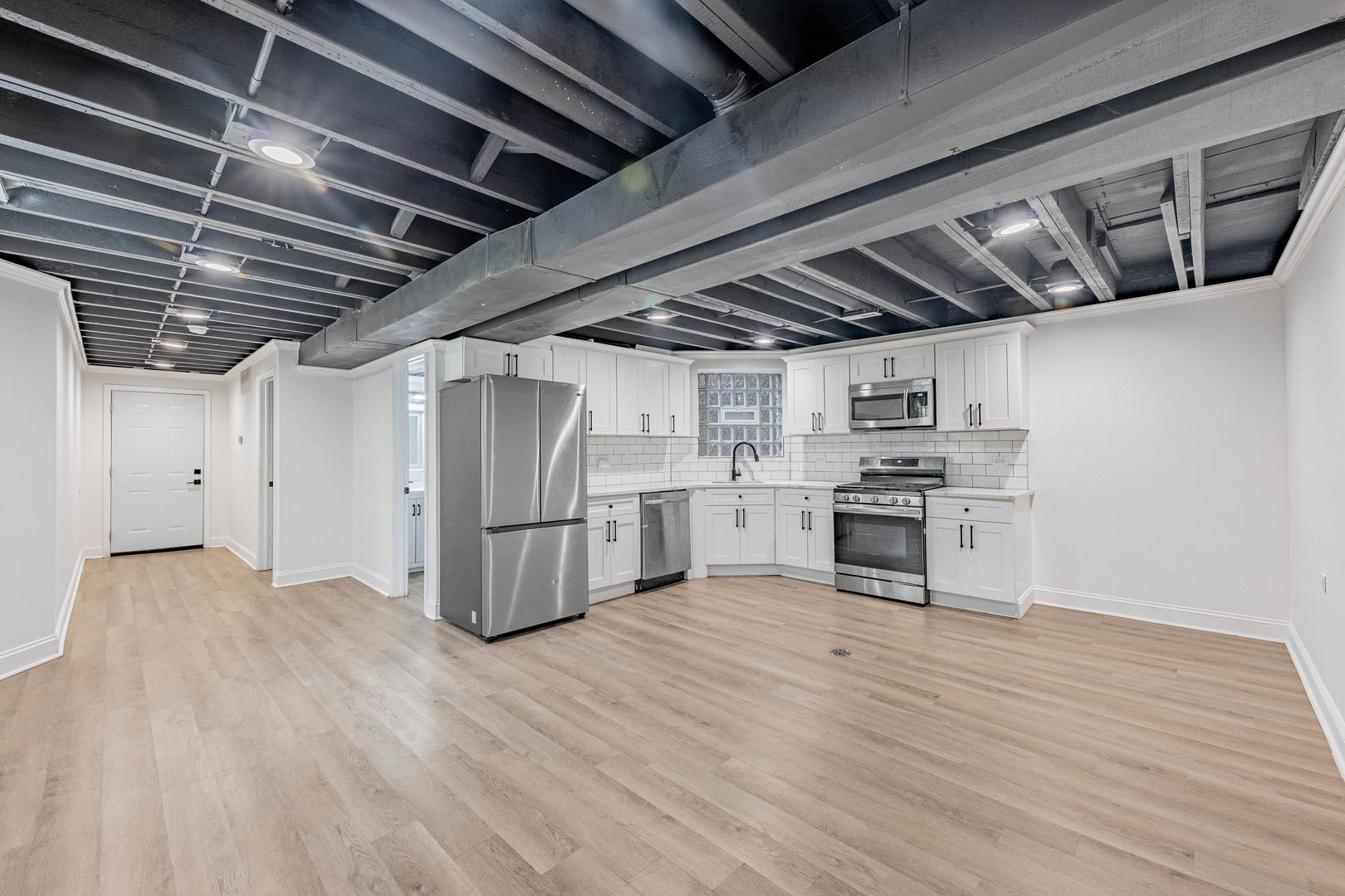 4453 West Adams Street Chicago, IL 60624 - Photo 20 of 32 a view of a kitchen with wooden floor