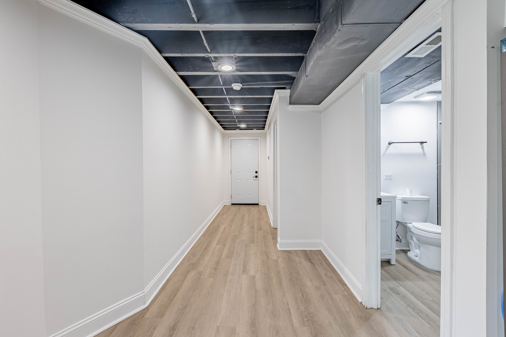 4453 West Adams Street Chicago, IL 60624 - Photo 27 of 32 a view of hallway with wooden floor