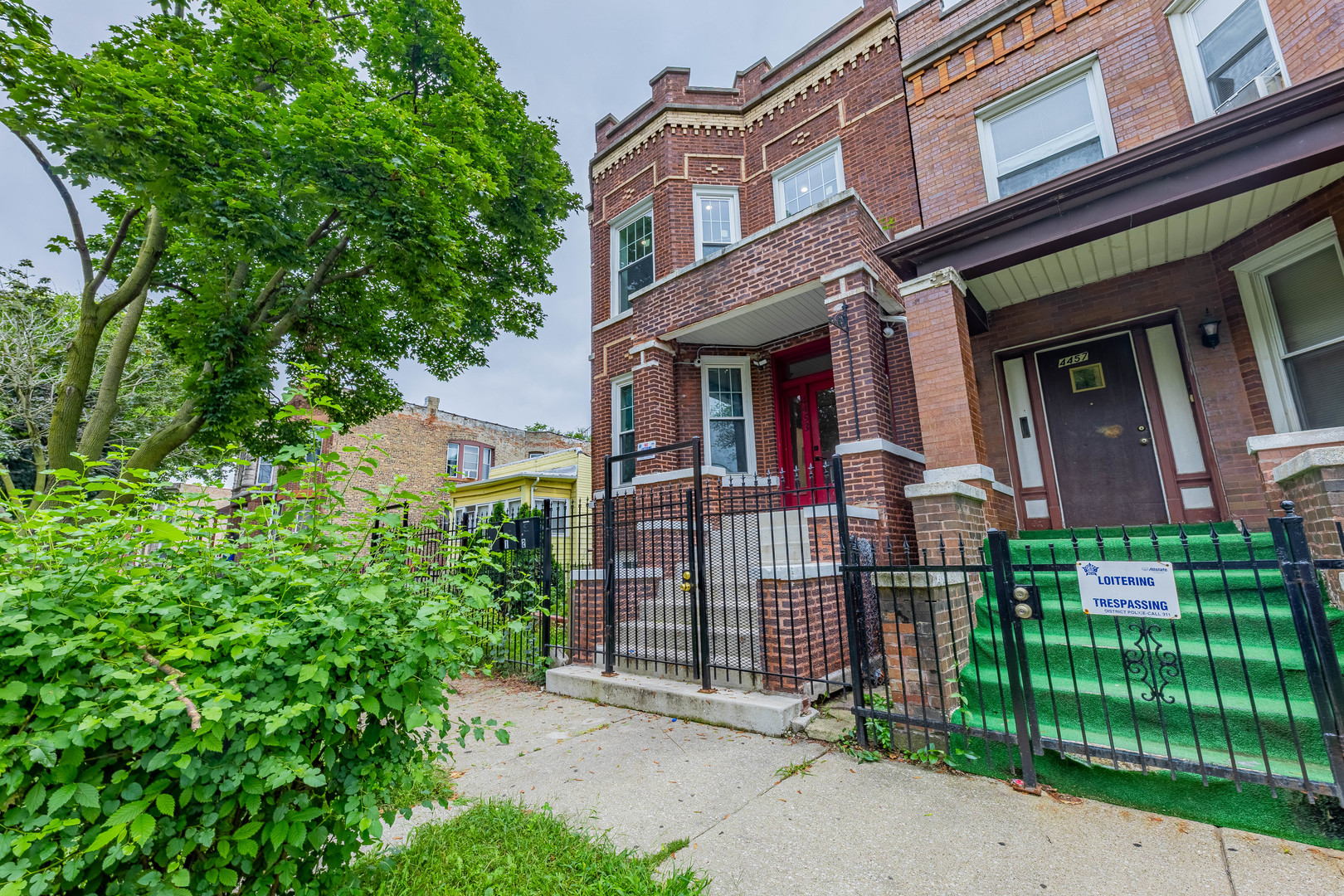 4453 West Adams Street Chicago, IL 60624 - Photo 32 of 32 front view of a house with a small yard
