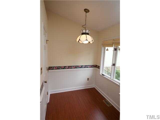 2808 Rue Sans Famille Raleigh, NC 27607 - Photo 3 of 3 a view of a room with a window and wooden floor