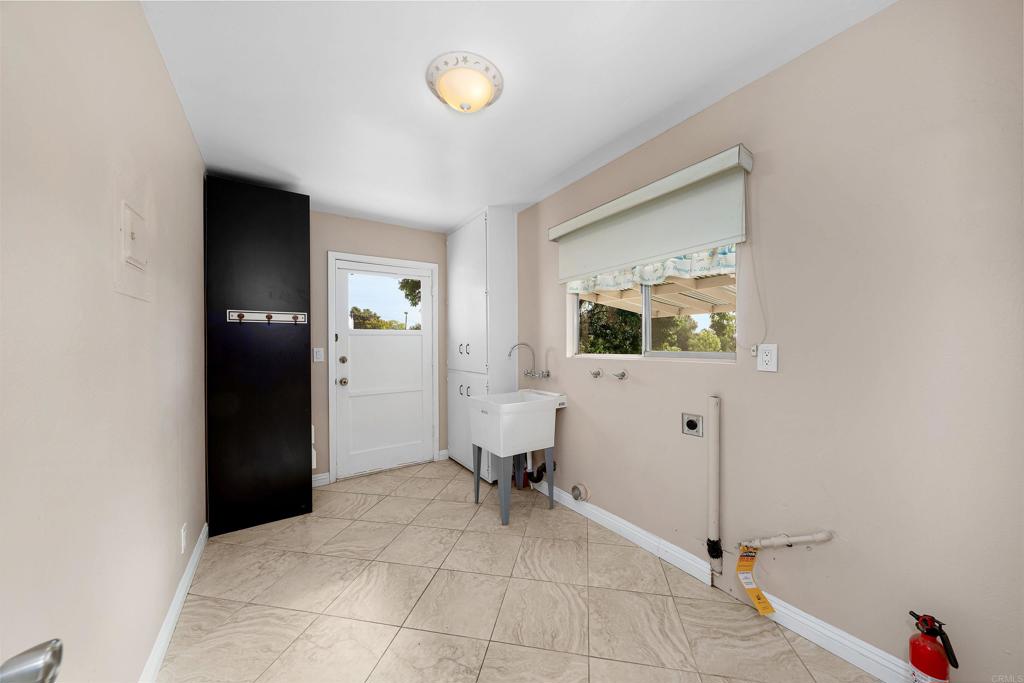 2073 Valley Rim Road El Cajon, CA 92019 - Photo 14 of 33 a view of a livingroom with a chair and front door