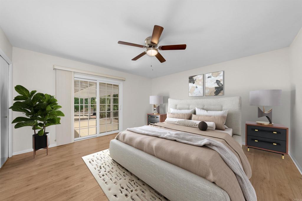 2073 Valley Rim Road El Cajon, CA 92019 - Photo 15 of 33 a bedroom with a bed and a potted plant