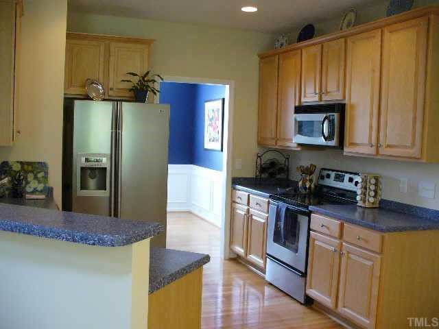 907 Martry Road Durham, NC 27713 - Photo 6 of 10 The kitchen is centrally located and allows for easy entertaining or family time.