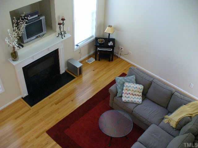 907 Martry Road Durham, NC 27713 - Photo 8 of 10 Cathedral ceilings make this room feel very spacious and offers loads of light.
