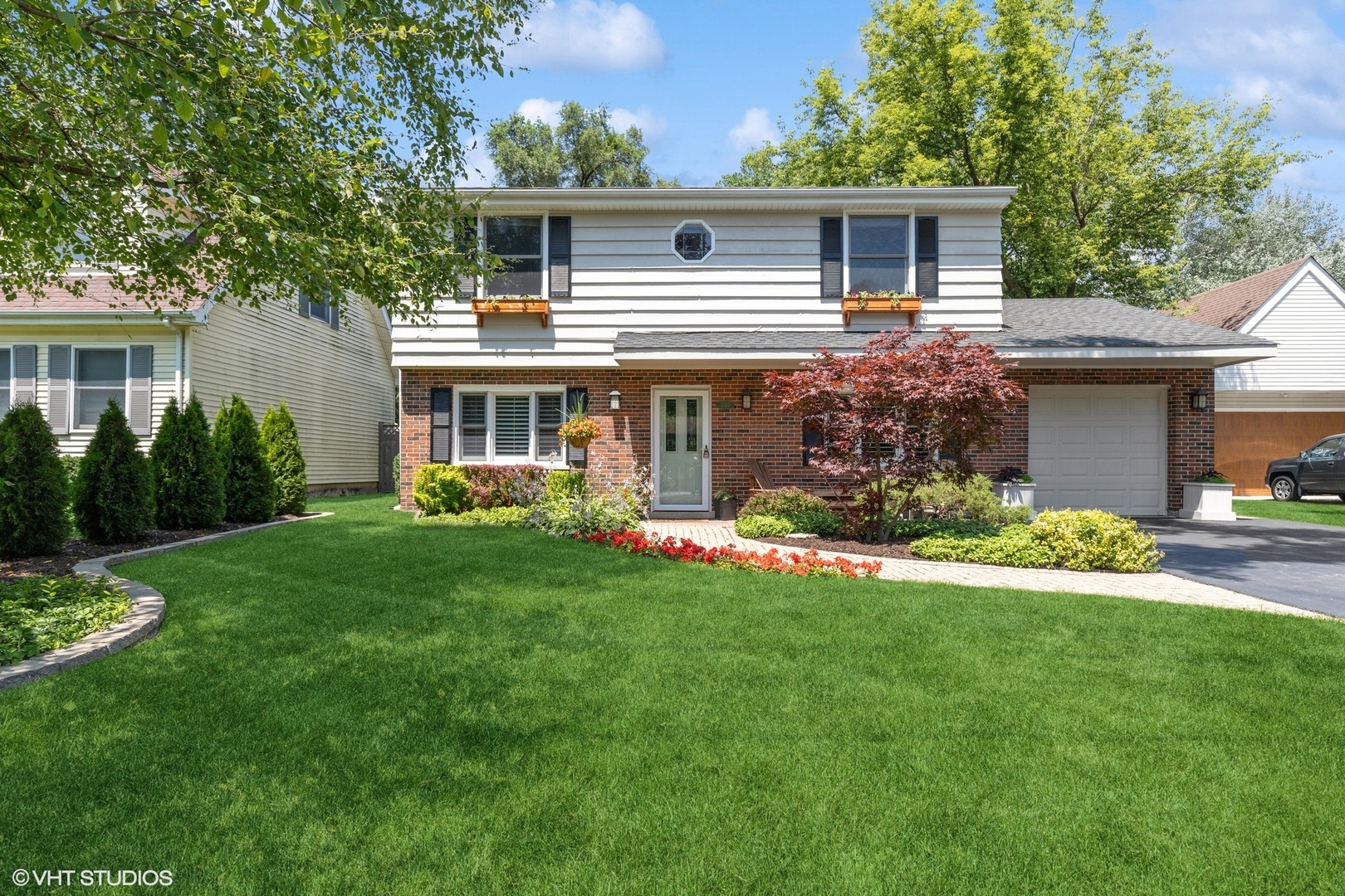 1005 Jenkisson Avenue Lake Bluff, IL 60044 - Photo 1 of 16 a front view of house with yard and green space