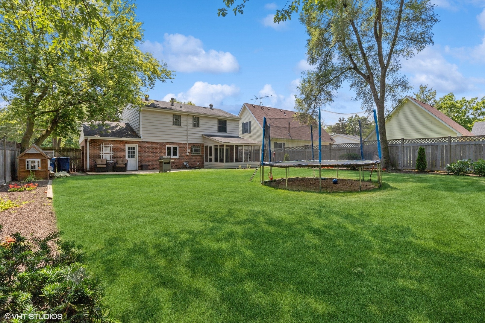 1005 Jenkisson Avenue Lake Bluff, IL 60044 - Photo 15 of 16 a view of a house with a back yard