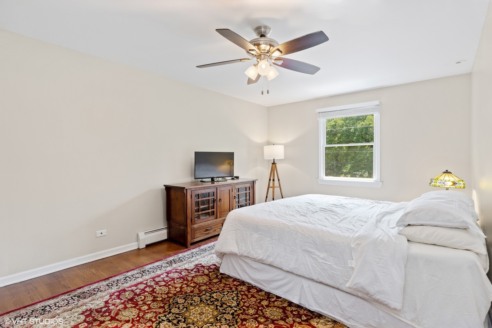 1005 Jenkisson Avenue Lake Bluff, IL 60044 - Photo 9 of 16 a bedroom with a bed and a tv