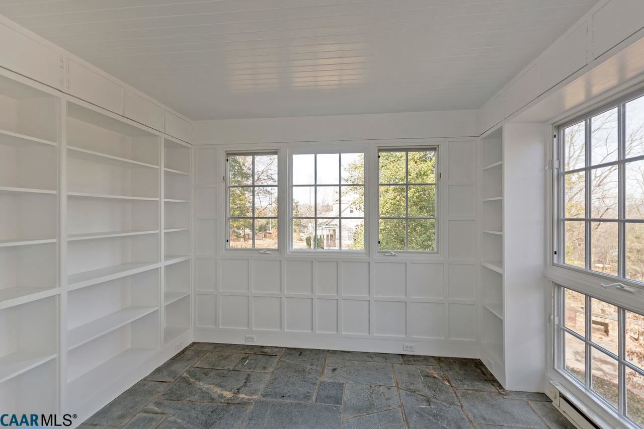 1536 Dairy Road Charlottesville, VA 22903 - Photo 17 of 37 Sunroom with slate floors and beautiful bookshelves!