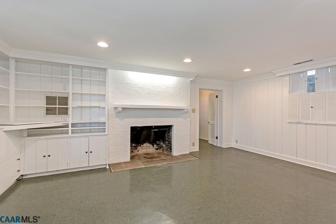 1536 Dairy Road Charlottesville, VA 22903 - Photo 30 of 37 Terrace level family room with wood burning fireplace and built in shelves.