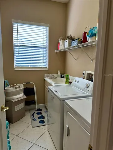 a utility room with washer and dryer