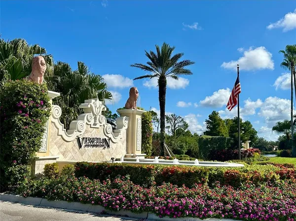 a view of a palm tree next to a yard