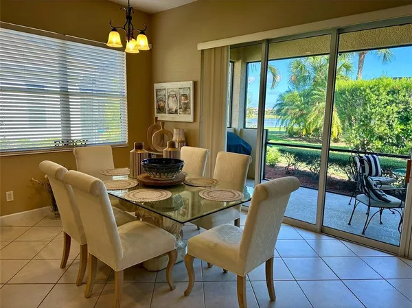 a dining room with furniture and window