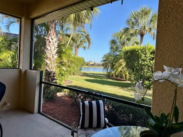 a view of a chair and table in the patio