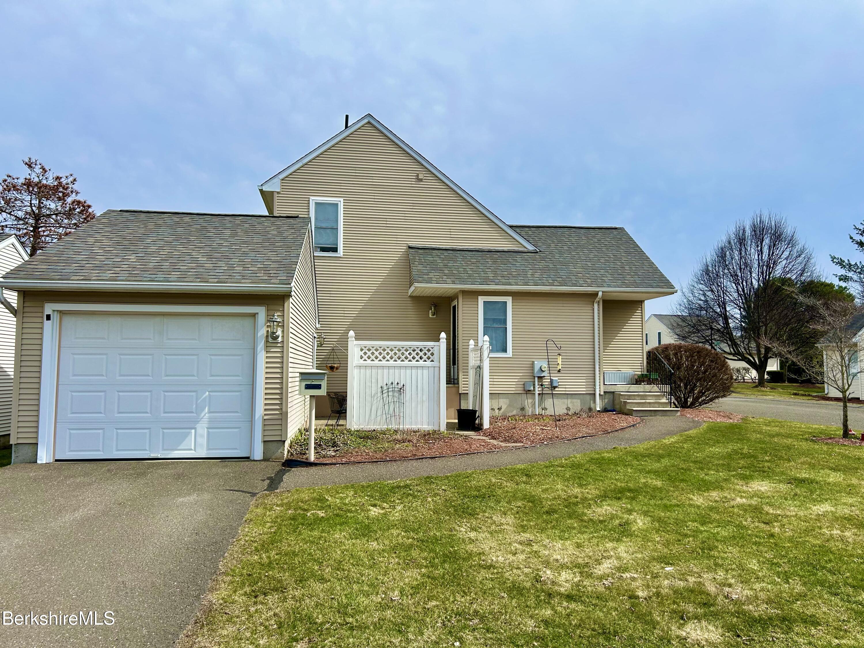 20 Richmond Way Chicopee, MA 01022 - Photo 1 of 25 a front view of a house with garden