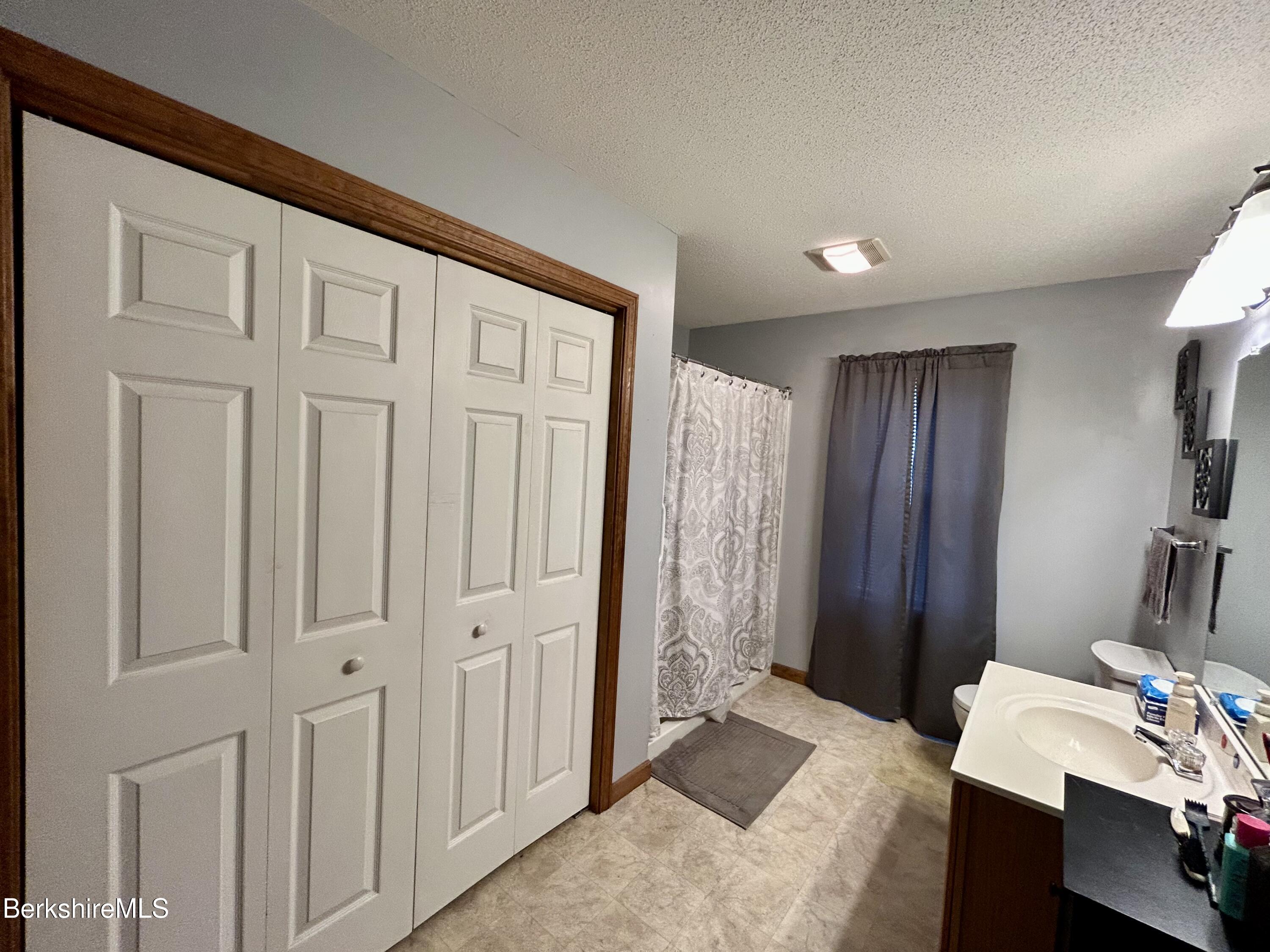 20 Richmond Way Chicopee, MA 01022 - Photo 11 of 25 a bedroom with a bed and a table
